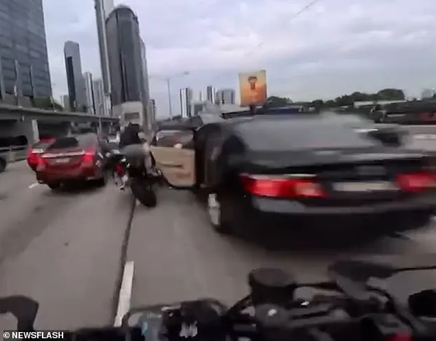 Toddler's Door Yank on Malaysia Motorway Causes Chain Reaction, Injuring Two Motorcyclists and Prompting Police Probe