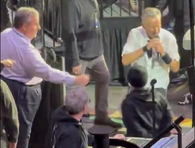 Springsteen walks past Christie at concert, sparking viral snub rumors.