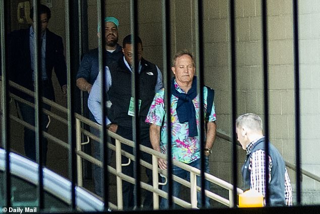 Ken Paxton exits hotel in Hawaiian shirt days after Trump endorsement.