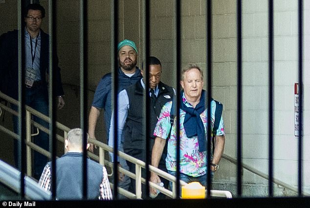 Ken Paxton exits hotel in Hawaiian shirt days after Trump endorsement.