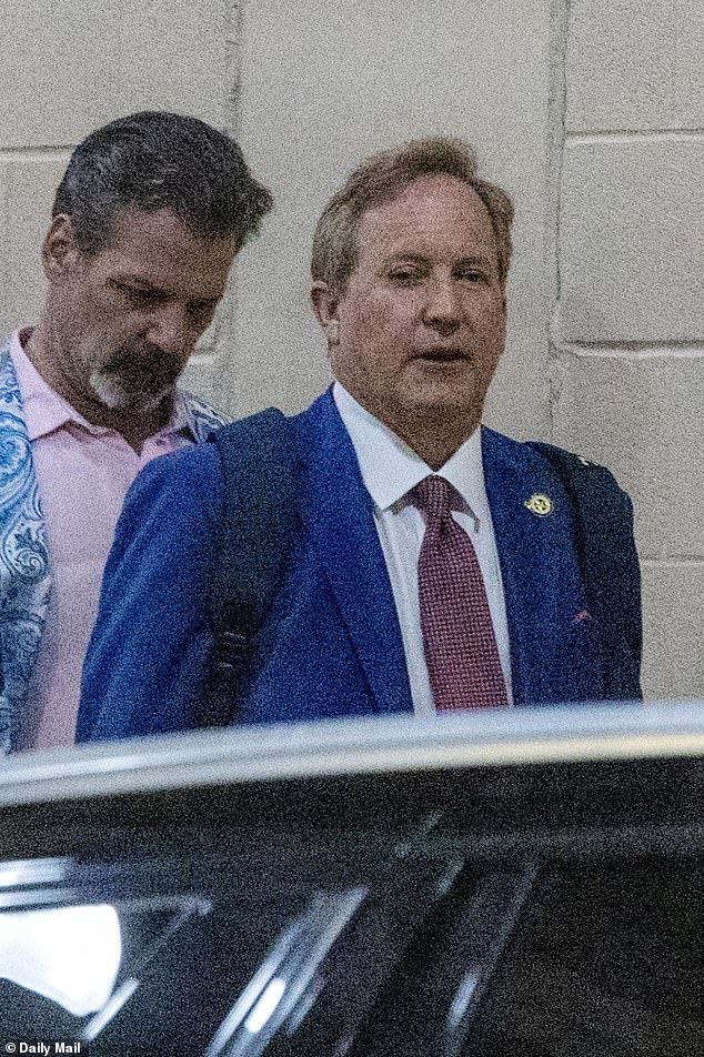 Ken Paxton exits hotel in Hawaiian shirt days after Trump endorsement.