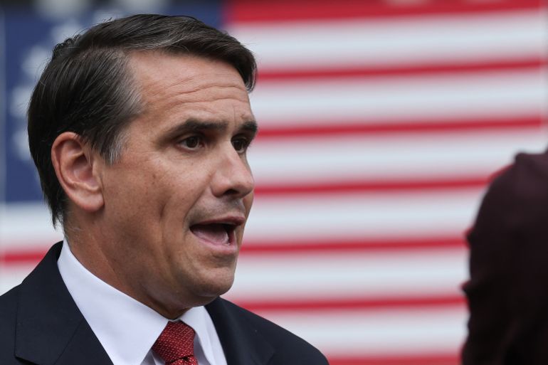 Justice Department sues four states over refusal to issue secret ICE plates.